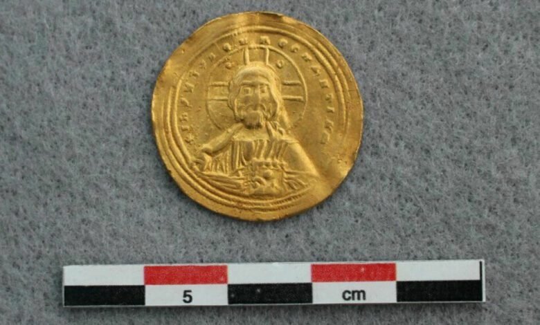 Jesus and the Bible are embossed on one side of the coin.